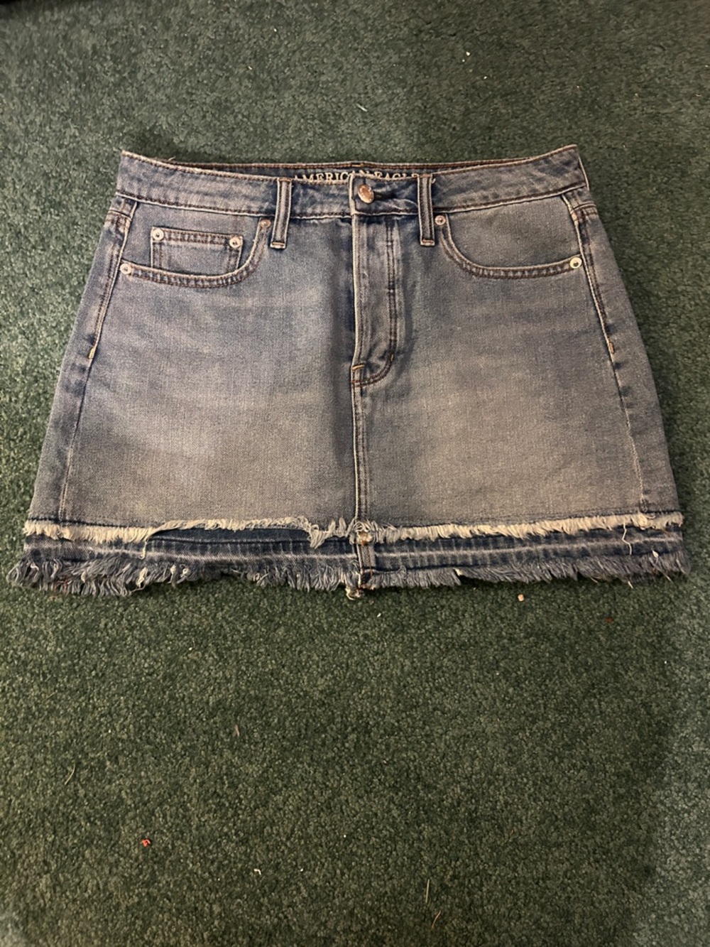 American Eagle Outfitters Blue Denim Mini Skirt with Frayed Hem Detail
